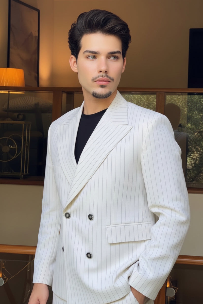 Our client taking a mirror selfie wearing a white pinstripe suit in an indoor setting.